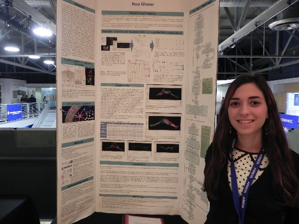 A student showcases her science fair project at a competition in April.